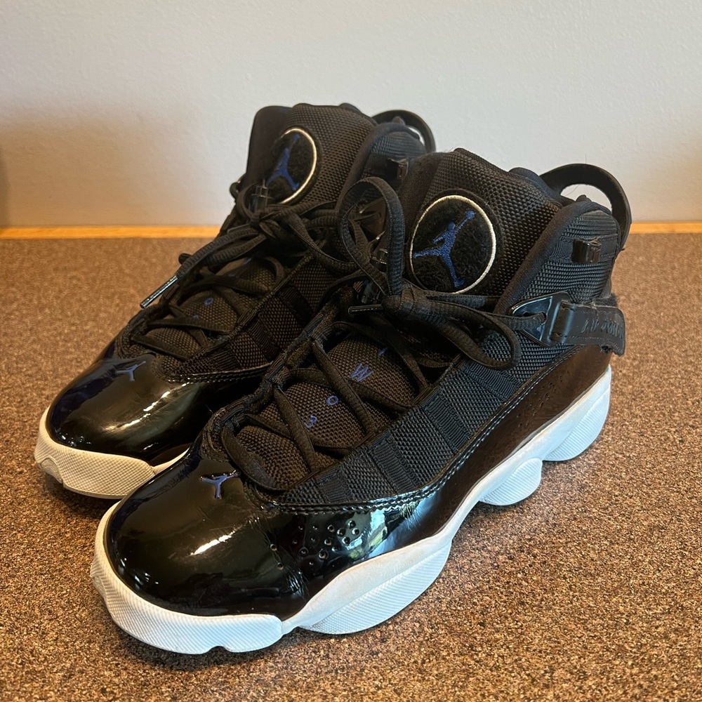 Nike Air Jordan high top 7Y or women’s 8. Black with some blue.